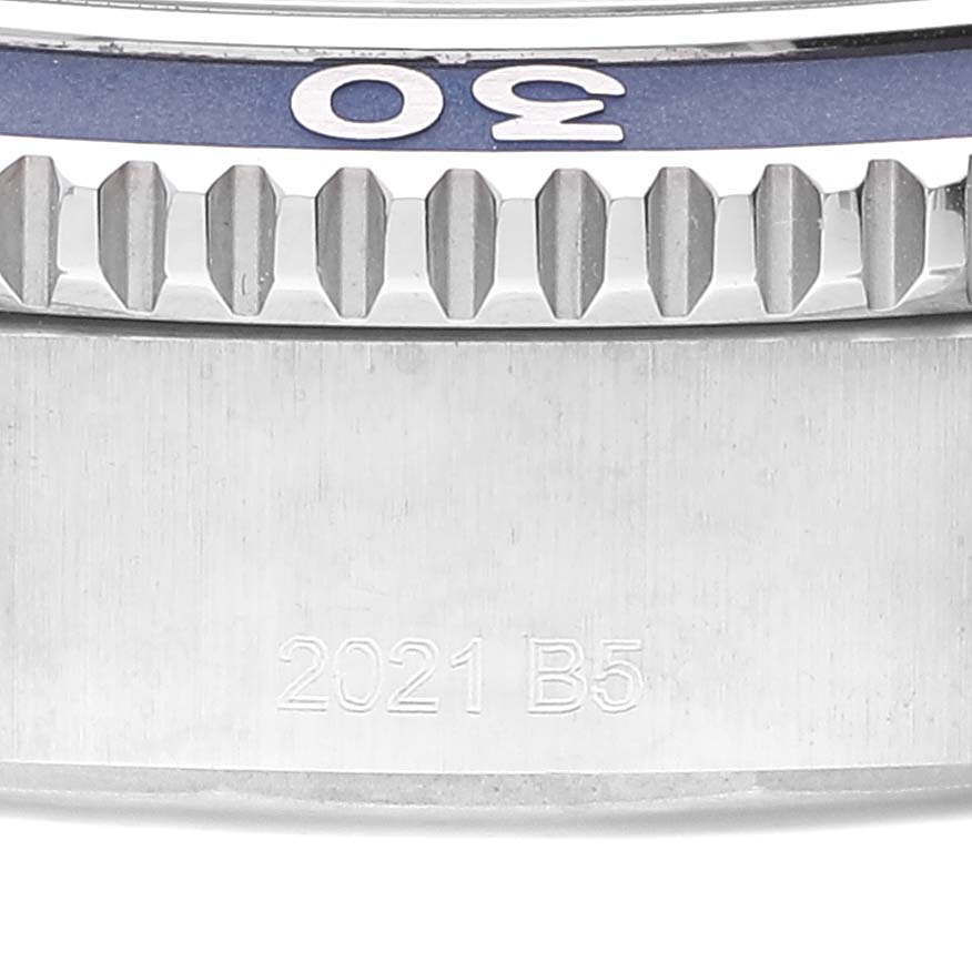 This close-up angle of the Breitling Superocean A17366 Men's Stainless Steel Blue Dial A17366 Men's Stainless Steel Blue Dial watch shows the bezel with 30 marking and part of the side case with the engraving "2021 B5."