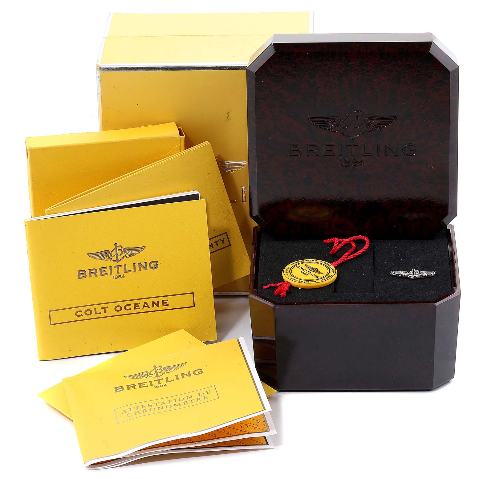 The image shows the packaging, manuals, and accessories for the Breitling A77380 Women's Stainless Steel Silver Dial A77380 Women's Stainless Steel Silver Dial Colt Oceane Stainless Steel Diamond Ladies Watch A77380 from a front angle.