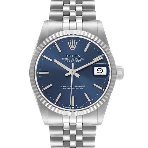 The Rolex Datejust Mid-Size watch is shown from the front, highlighting the blue dial, fluted bezel, and Jubilee bracelet.
