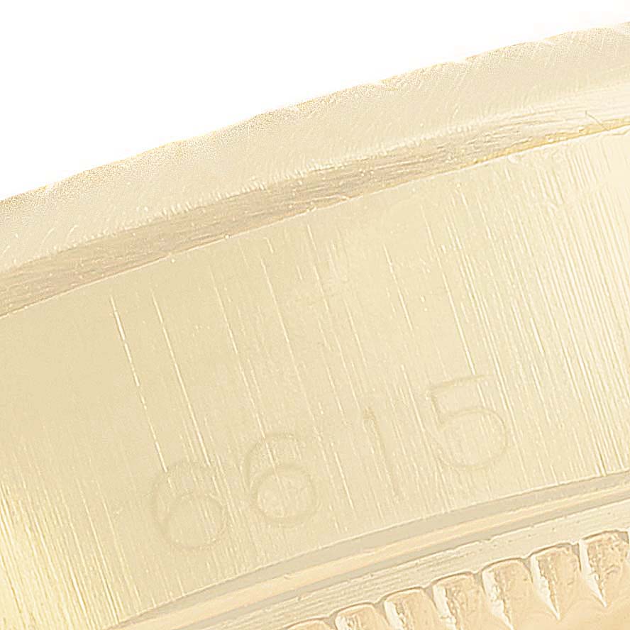 The image shows a close-up angled view of the side of an Oyster Perpetual Rolex watch case detailing the engravings.