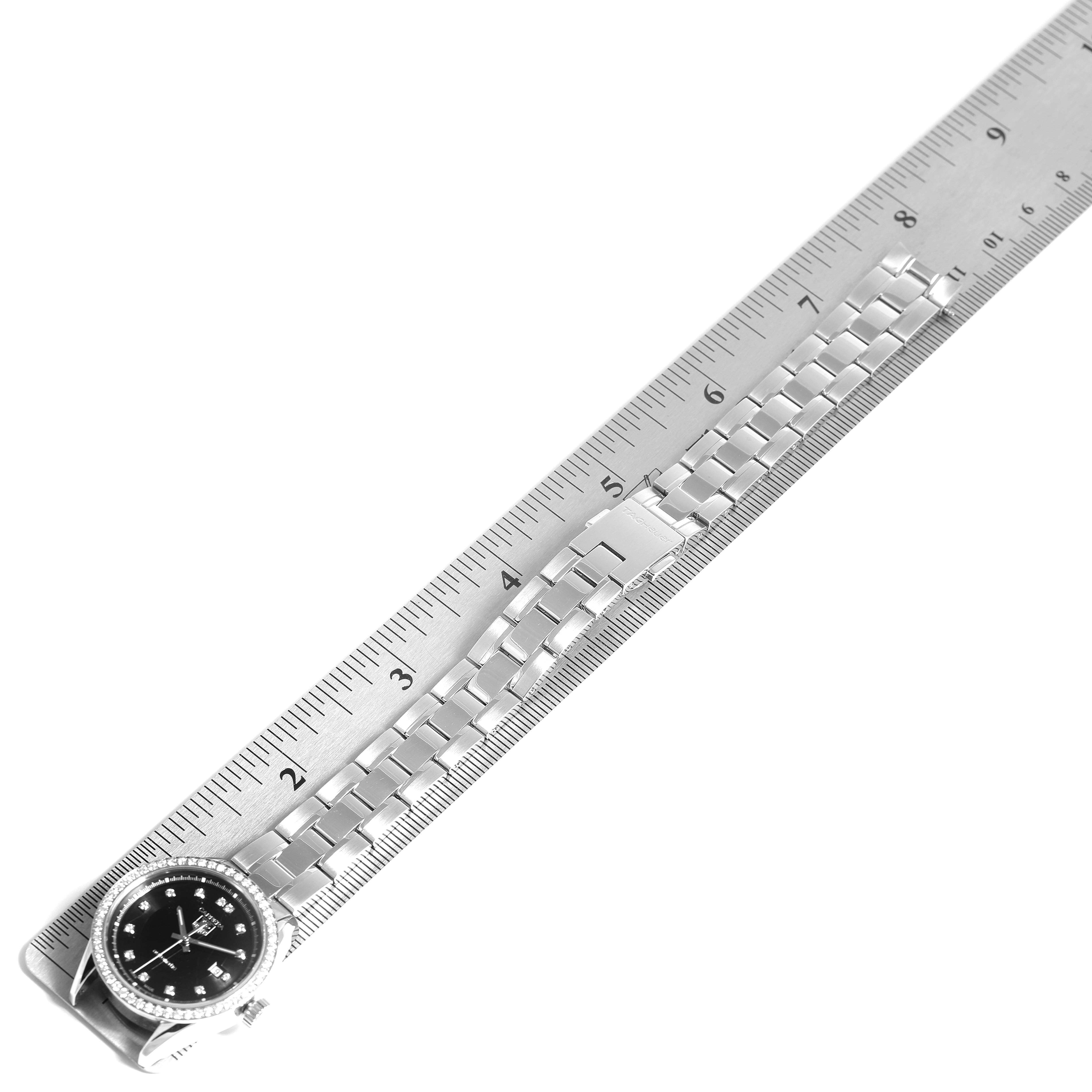 The Tag Heuer Carrera WV2412.BA0793 Women's Stainless Steel Black Dial WV2412.BA0793 Women's Stainless Steel Black Dial watch is shown from an angled top view, displaying the face and metal bracelet.