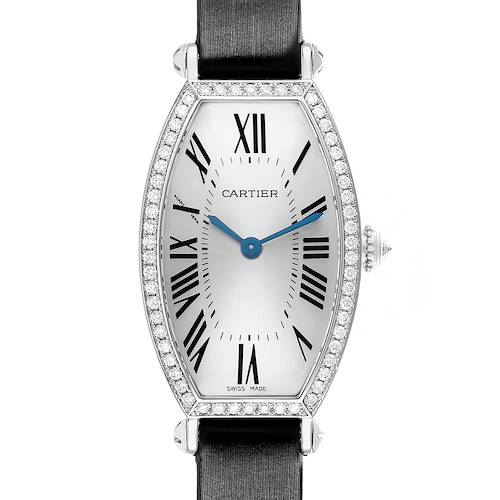 The Cartier Tonneau WE400131 Women's White Gold Silver Dial model watch is shown from a front angle, highlighting the face, Roman numerals, and diamond set bezel.