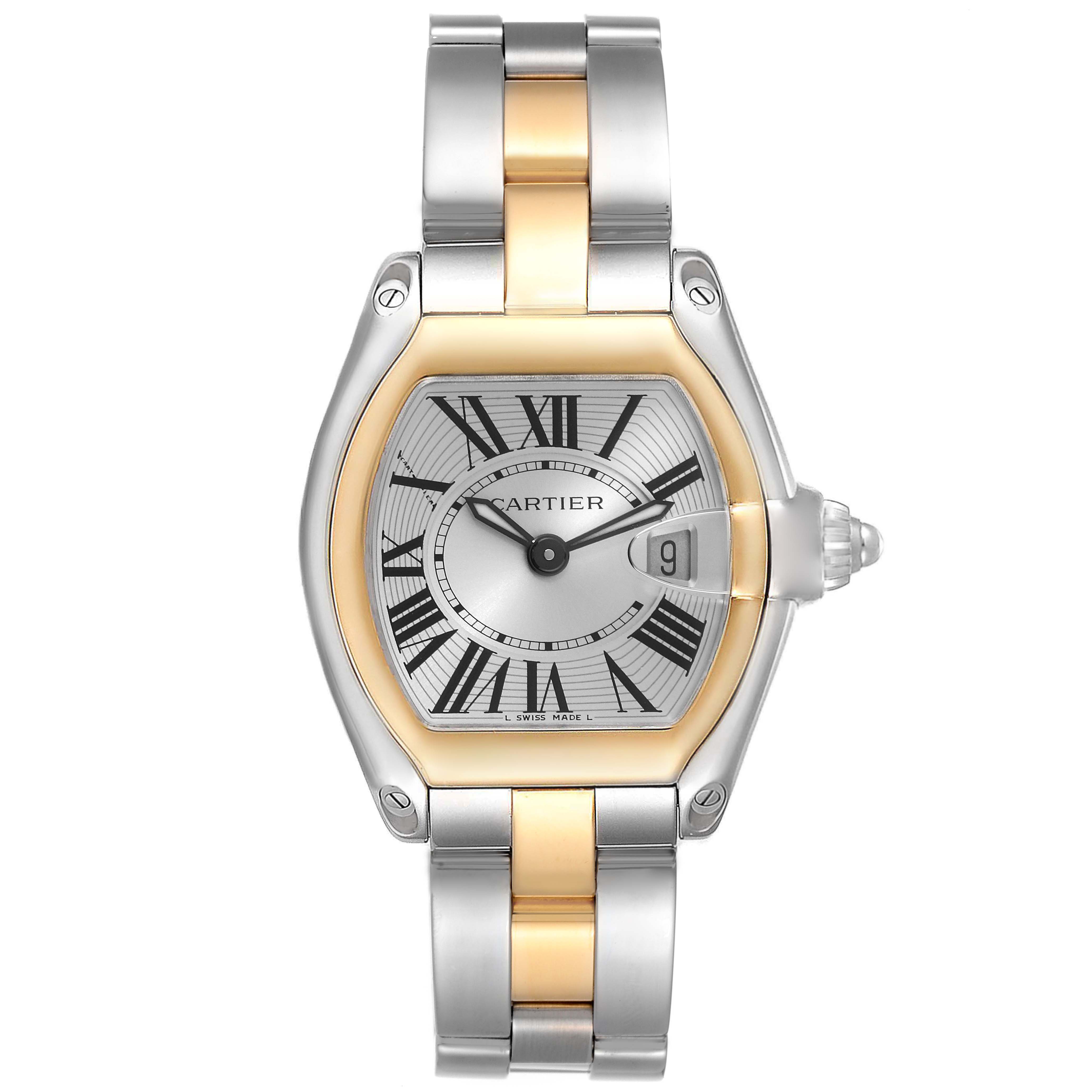 The image shows a Cartier Roadster W62026Y4 Women's Steel and Gold (two tone) Silver Dial W62026Y4 Women's Steel and Gold (two tone) Silver Dial model watch, featuring a two-tone metal bracelet, Roman numerals, and a date display at 3 o'clock.