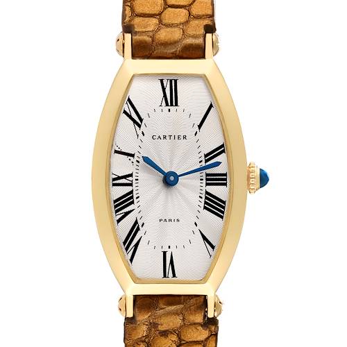 This is a front view of the Cartier Tonneau Women's Yellow Gold Silver Dial Women's Yellow Gold Silver Dial model watch, showing its dial, hands, case, and part of the strap.