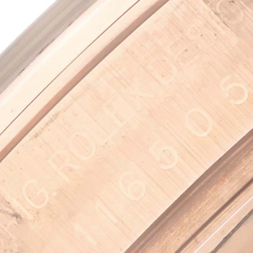 This close-up image shows the engraved inner bezel of a Rolex Daytona 116505 Men's Rose Gold Pink Dial 116505 Men's Rose Gold Pink Dial watch.