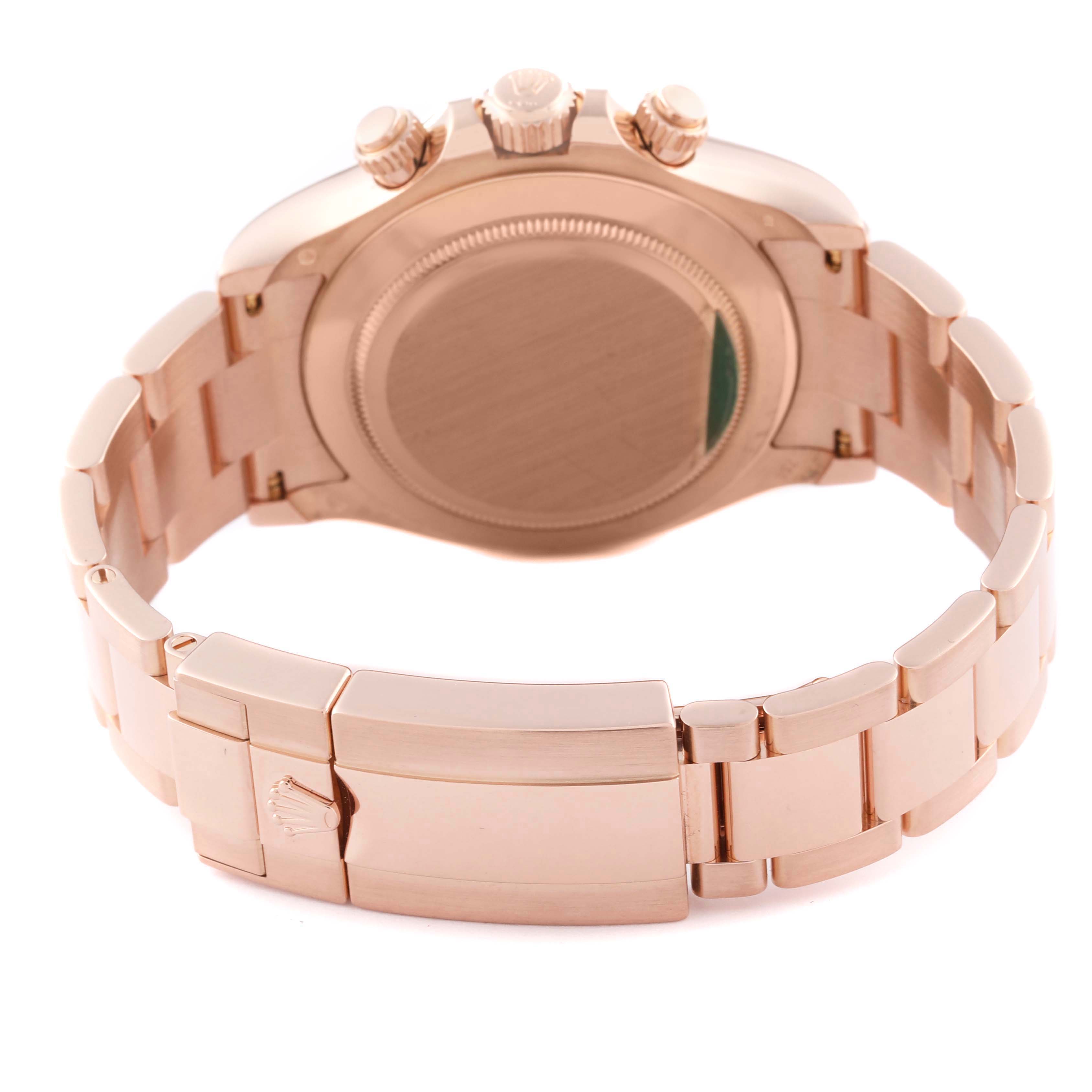 The image shows the back and clasp of the Rolex Daytona 116505 Men's Rose Gold Pink Dial 116505 Men's Rose Gold Pink Dial watch, highlighting its metallic strap and case back.