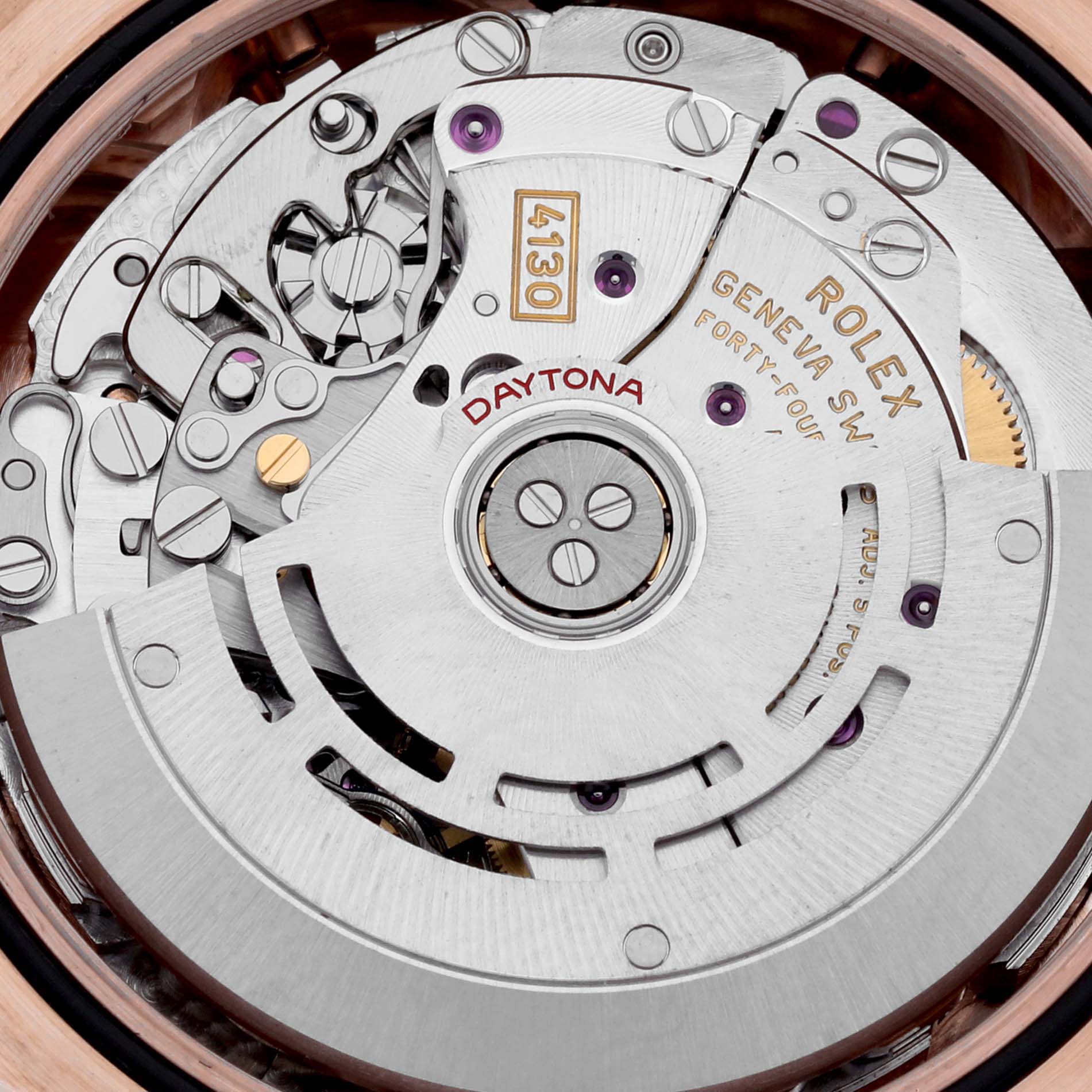 This image shows the interior mechanical movement of a Rolex Daytona 116505 Men's Rose Gold Pink Dial 116505 Men's Rose Gold Pink Dial watch, focusing on the intricate details of its components.