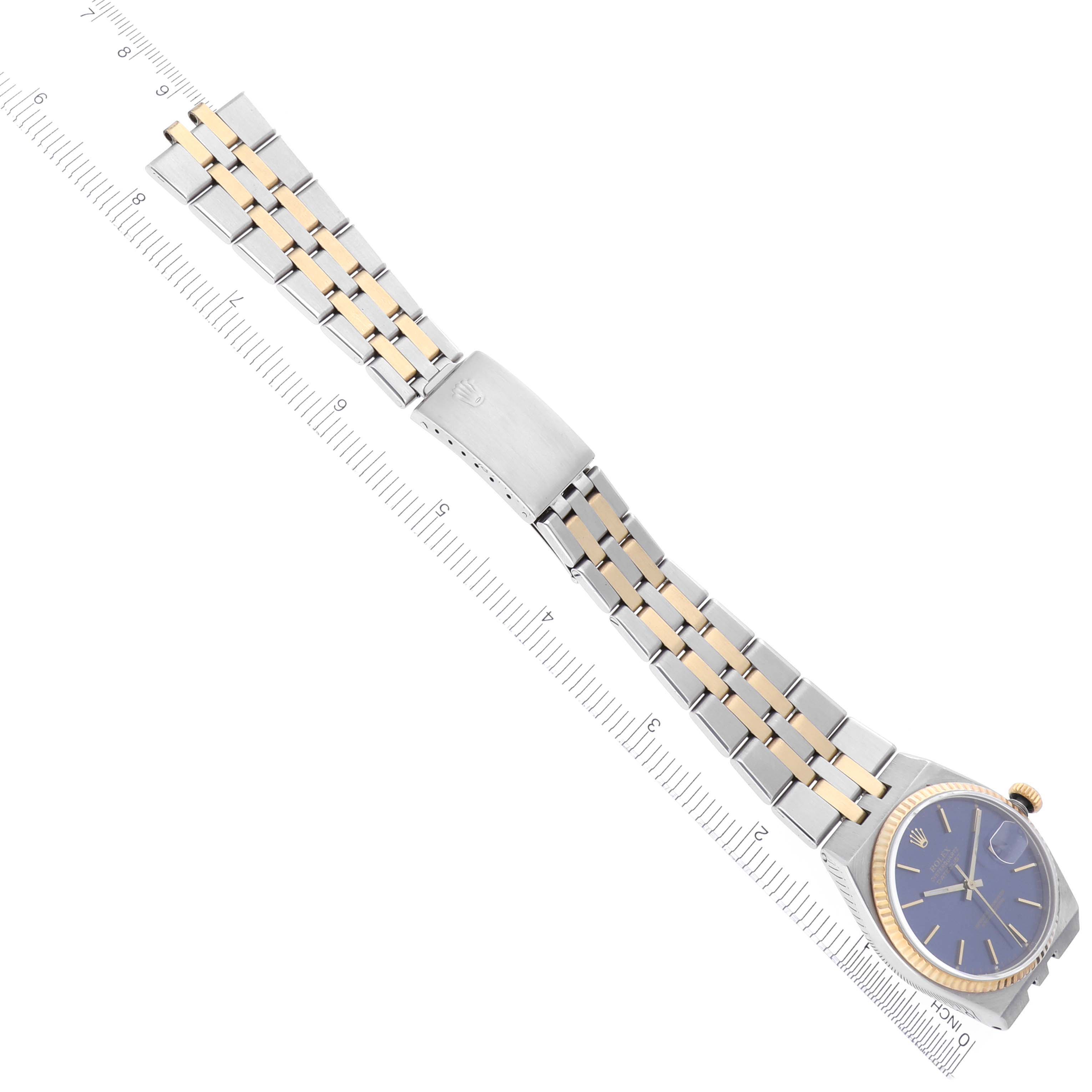 The image shows the Rolex Oysterquartz 17013 Men's Steel and Gold (two tone) Blue Dial 17013 Men's Steel and Gold (two tone) Blue Dial watch at a slight diagonal angle, featuring its bracelet, clasp, and blue dial.