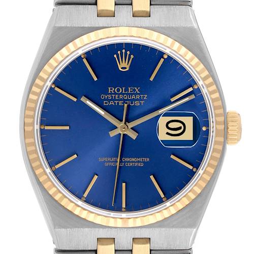 The image shows a front view of a Rolex Oysterquartz 17013 Men's Steel and Gold (two tone) Blue Dial 17013 Men's Steel and Gold (two tone) Blue Dial Datejust watch featuring a blue dial, date window, and gold-trimmed bezel.