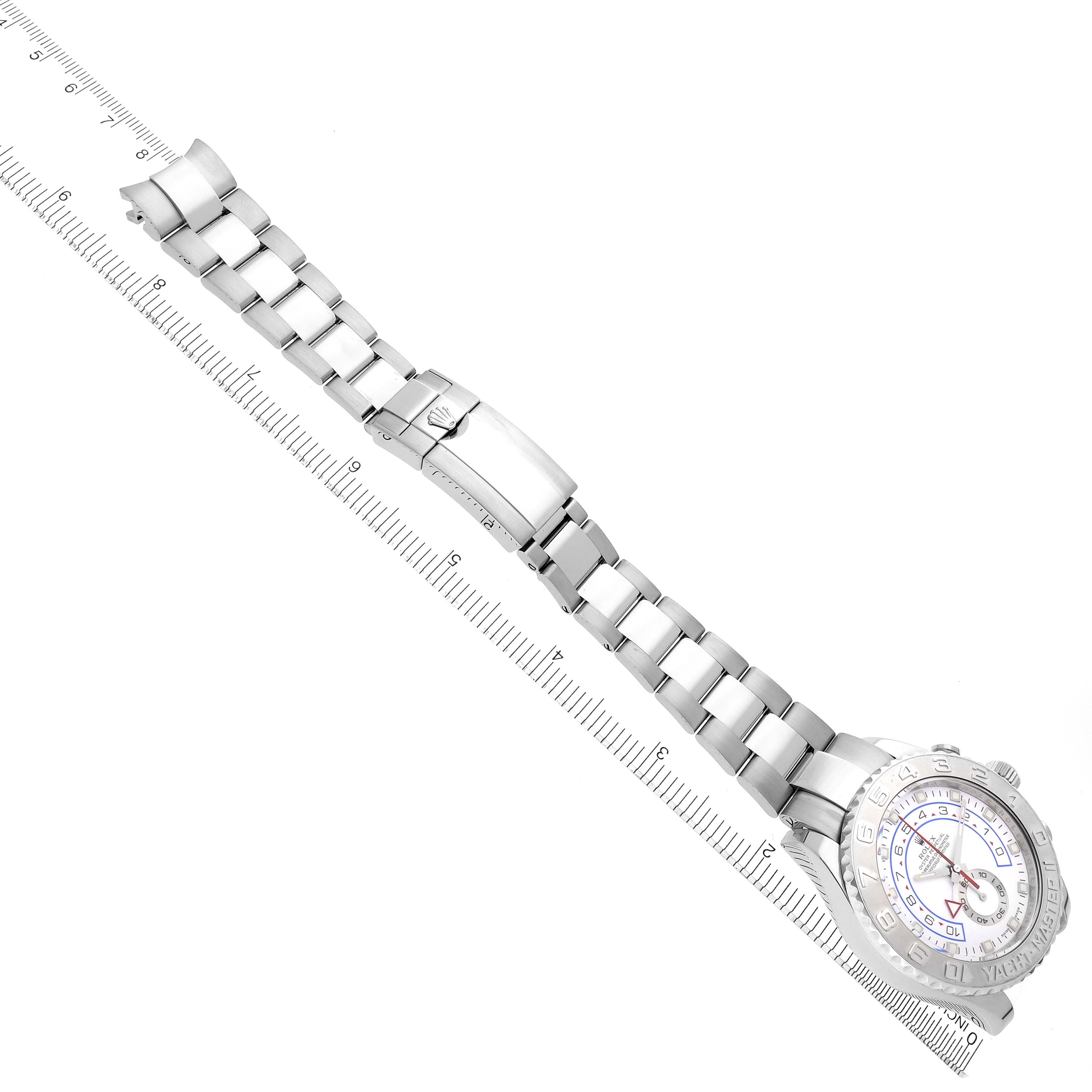 This image shows an overhead view of a Rolex Yacht-Master 116689 Men's White Gold Silver Dial 116689 Men's White Gold Silver Dial watch, displaying the bracelet, clasp, and partial face along a ruler for scale.