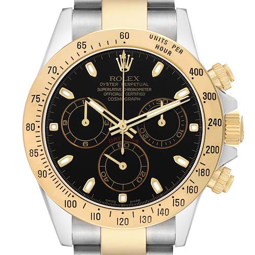 The Rolex Daytona 116523 Men's Steel and Gold (two tone) Black Dial watch is shown from a top-down angle, highlighting its bezel, dial, and pushers.