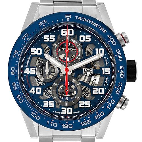 The image shows the front view of a Tag Heuer Carrera CAR2A1K.BA0703 Men's Stainless Steel Blue Dial CAR2A1K.BA0703 Men's Stainless Steel Blue Dial watch, featuring its blue tachymeter bezel and skeleton dial with chronograph sub-dials.