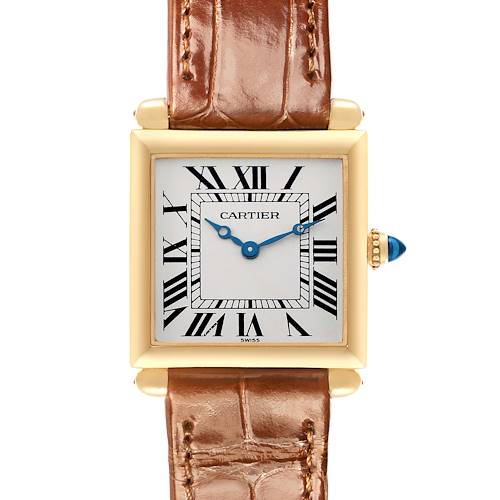 The image shows a frontal view of the Cartier Tank Obus W1512256 Women's Yellow Gold Silver Dial, highlighting the square face, Roman numerals, and a brown leather strap.
