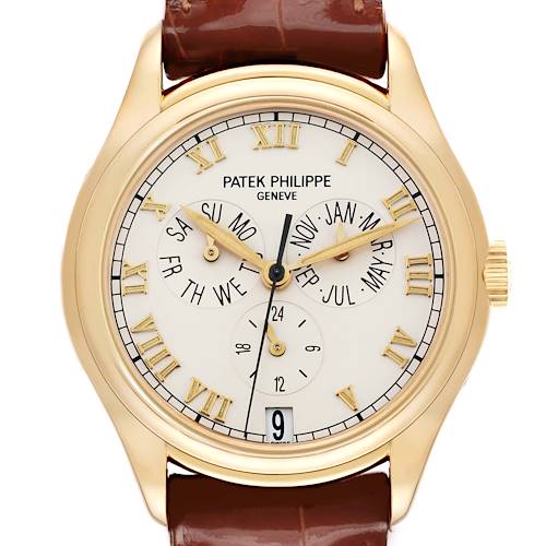 The Patek Philippe Complications 5035J Men's Yellow Gold White Dial watch is shown from a front angle, highlighting the dial, hands, subdials, and Roman numeral markers.