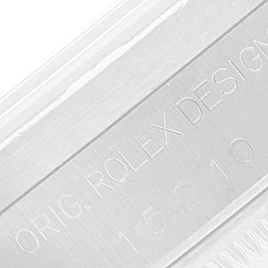 The image shows a close-up of the engraved serial number on the case of a Rolex Date 15210 Men's Stainless Steel Black Dial 15210 Men's Stainless Steel Black Dial model watch.