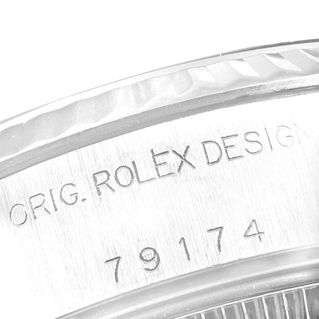 The image shows a close-up of the side engraving on the bezel of a Rolex Datejust 79174 Women's Stainless Steel Mother of Pearl Dial 79174 Women's Stainless Steel Mother of Pearl Dial model.