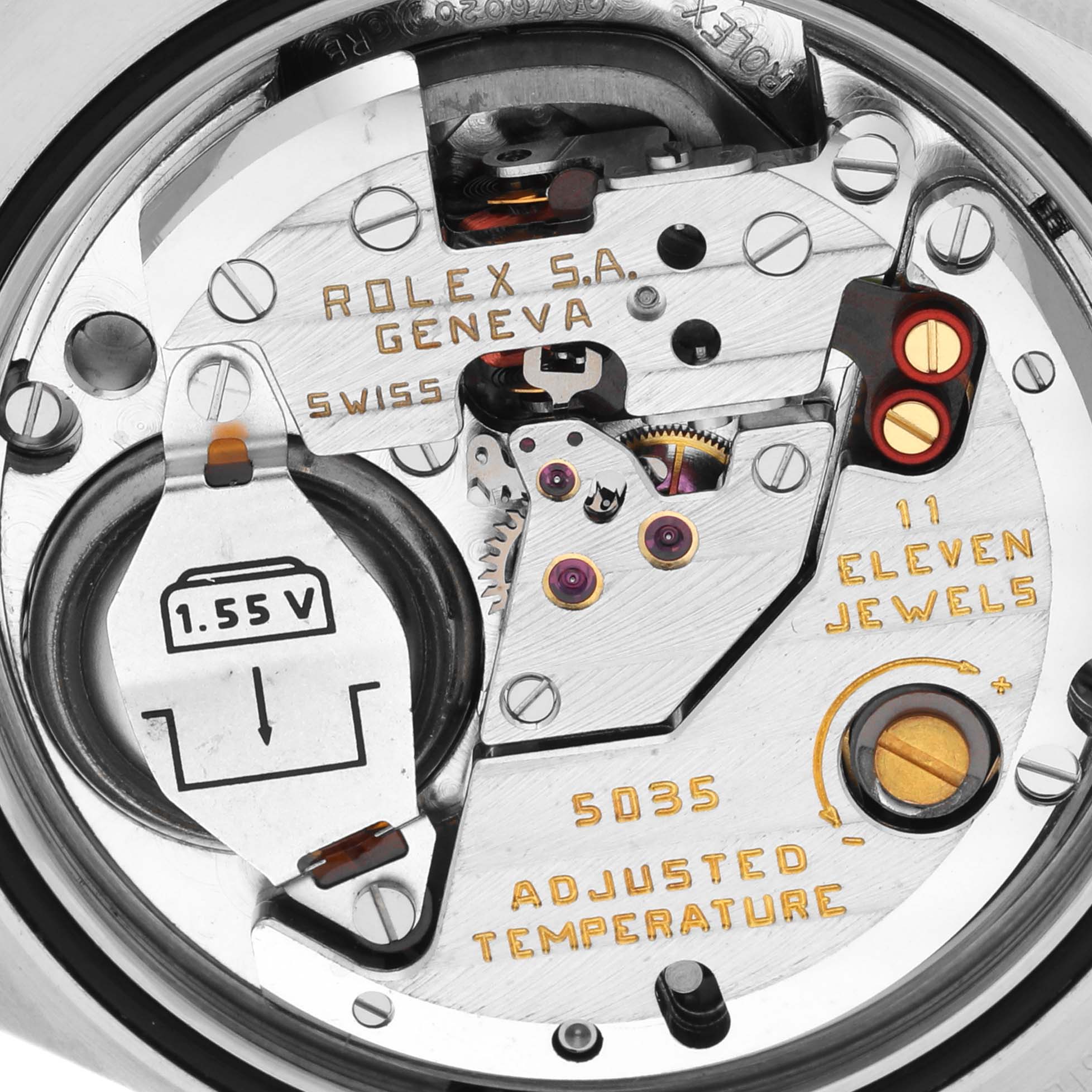 Close-up of the Rolex Oysterquartz 17013 Men's Steel and Gold (two tone) Black Dial 17013 Men's Steel and Gold (two tone) Black Dial movement showing the inner mechanisms and engraved markings.