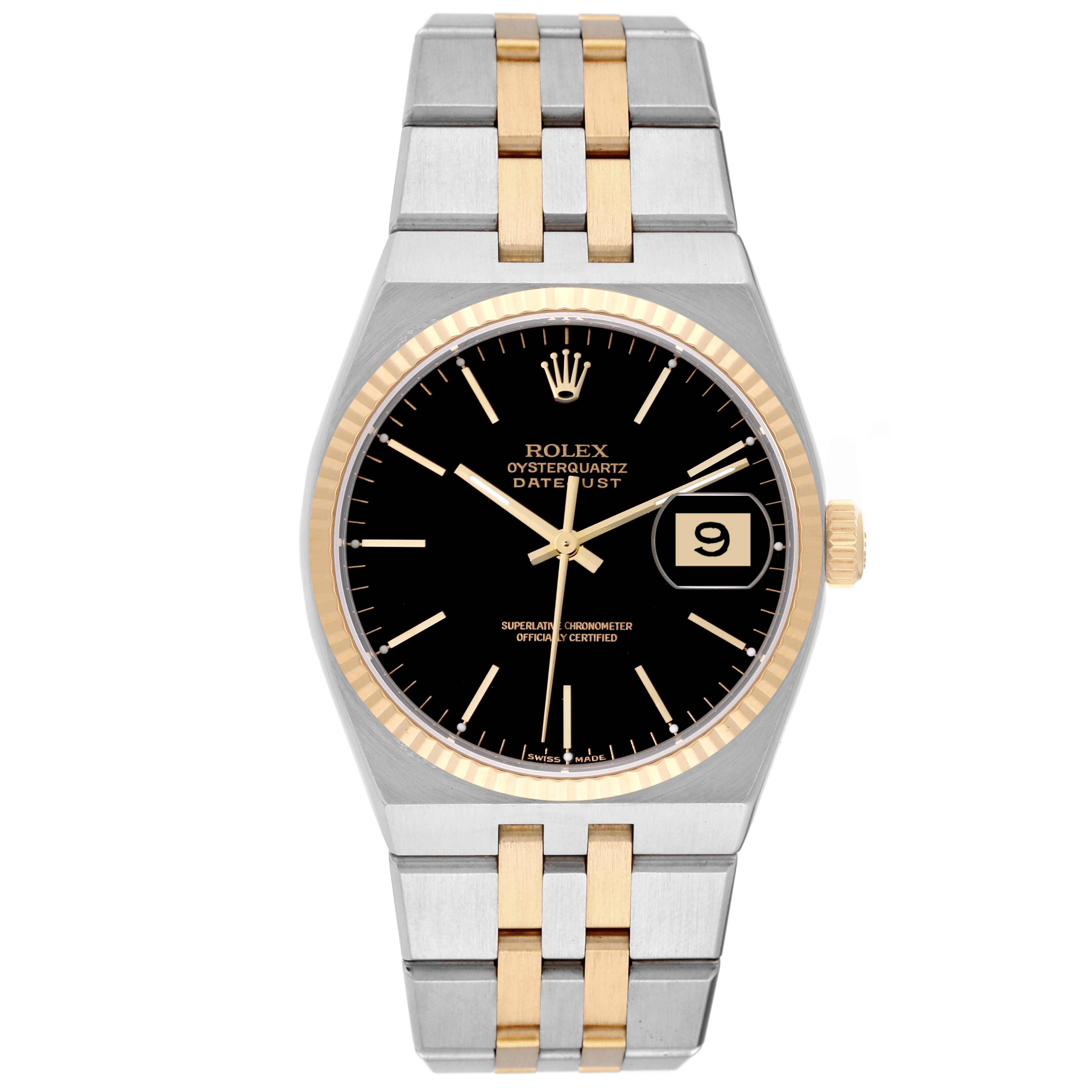 The image shows a Rolex Oysterquartz 17013 Men's Steel and Gold (two tone) Black Dial 17013 Men's Steel and Gold (two tone) Black Dial Datejust watch from a top-down angle, featuring a black dial and a two-tone metal bracelet.