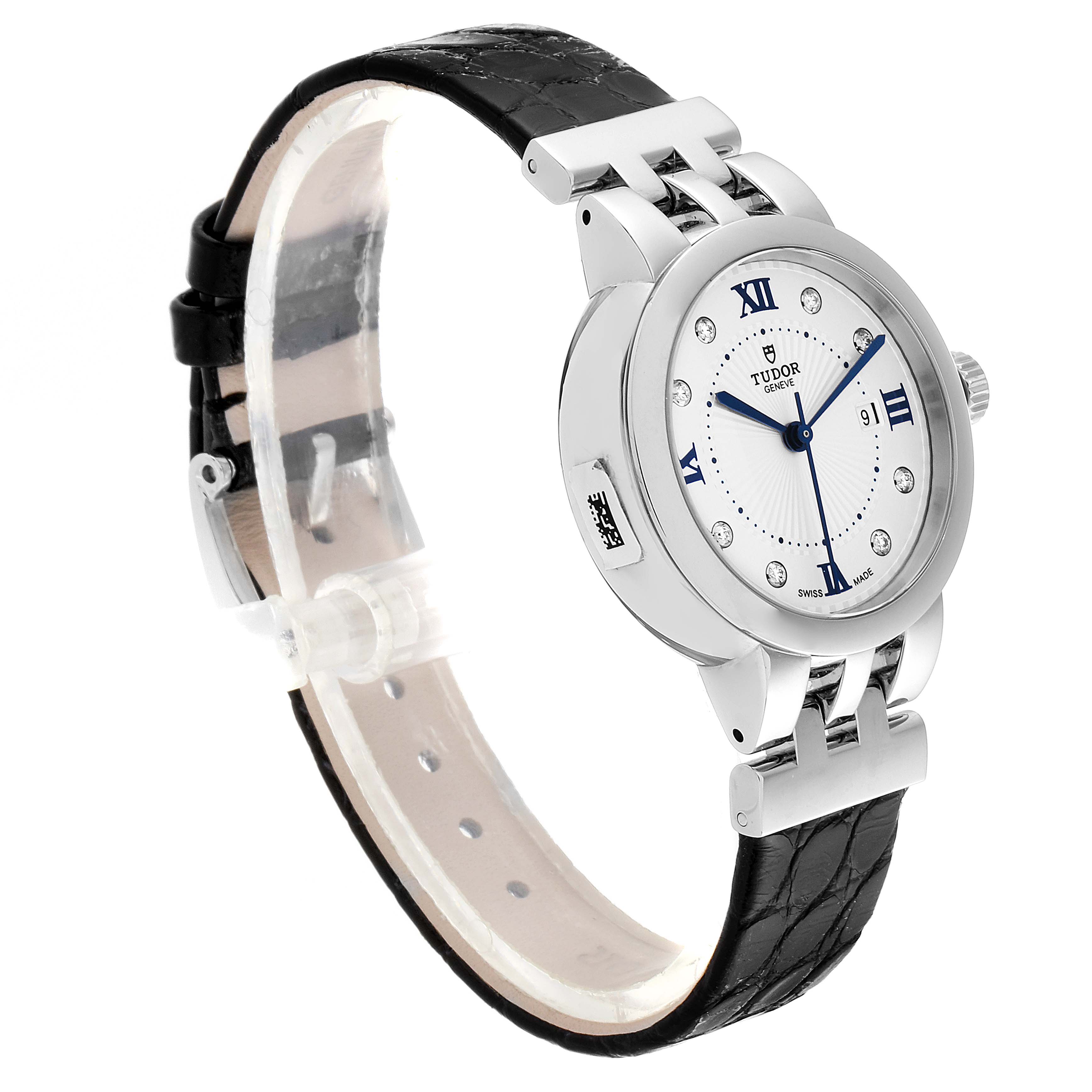 The image shows a Tudor Clair de Rose M35800-0006 Women's Stainless Steel Silver Dial M35800-0006 Women's Stainless Steel Silver Dial watch at a three-quarter angle, highlighting the face, bezel, and black leather strap.