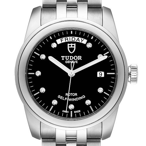 The image shows a frontal view of a Tudor Glamour M56000-0008 Men's Stainless Steel Black Dial M56000-0008 Men's Stainless Steel Black Dial model watch, featuring a black dial, date window, and metal bracelet.
