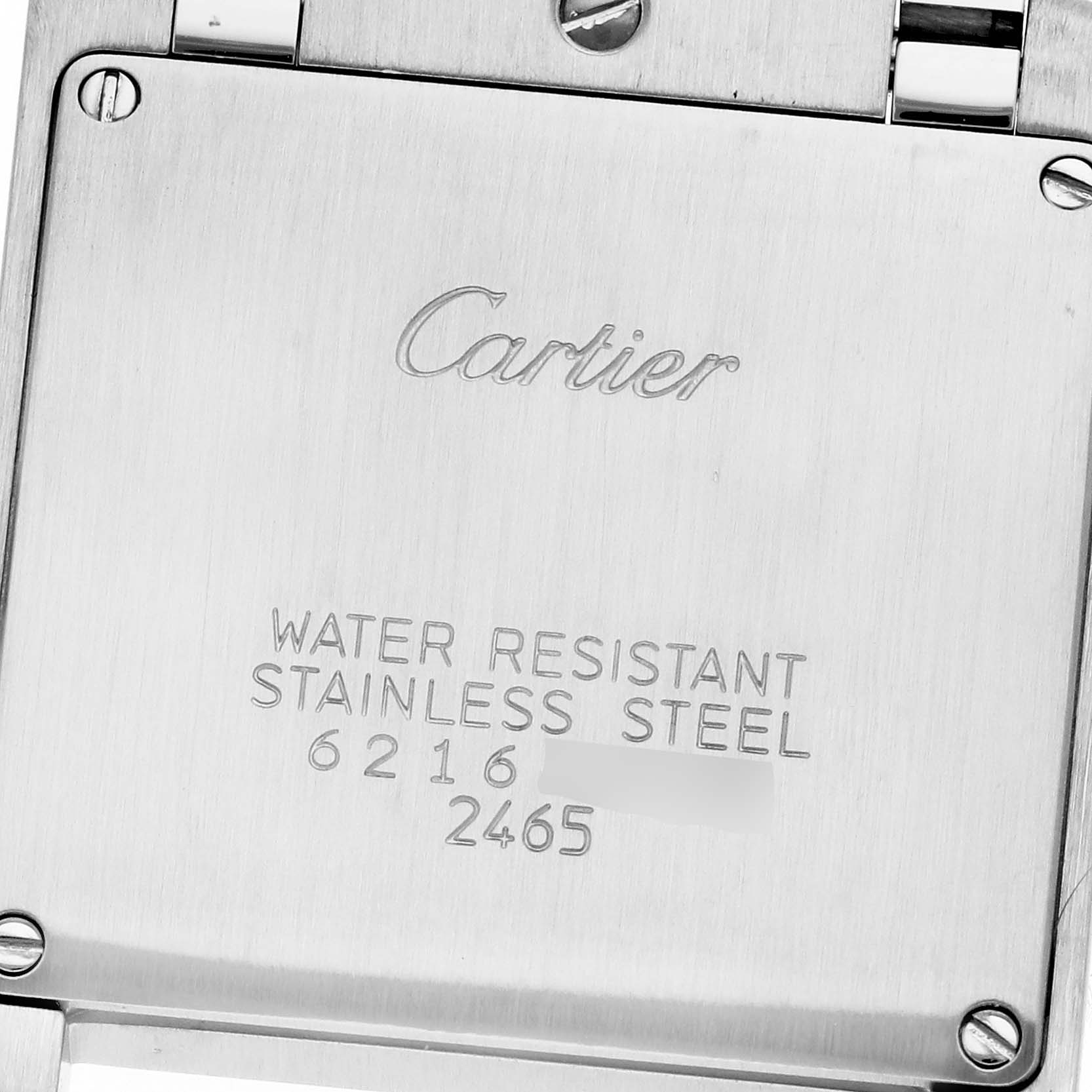 This image shows the back case of a Cartier Tank Française watch, highlighting engravings and screws at an upward angle.