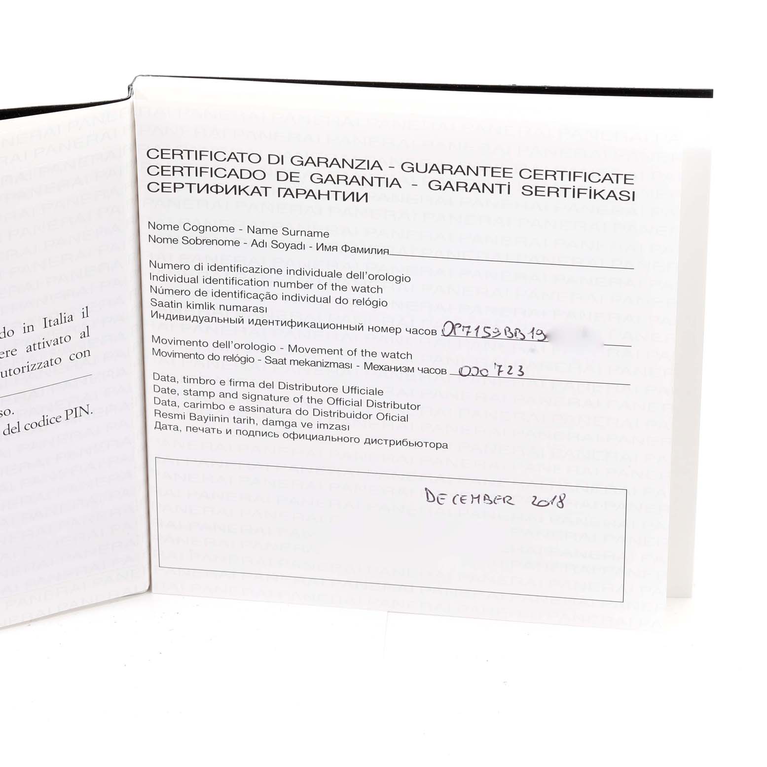 The image shows an open warranty certificate booklet for a Panerai Luminor PAM00797 Men's Titanium Brown Dial PAM00797 Men's Titanium Brown Dial watch, photographed from a slightly angled overhead view.