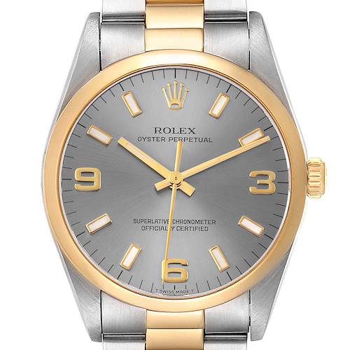 The image shows a front view of the Rolex Oyster Perpetual 14203 Men's Steel and Gold (two tone) Grey Dial 14203 Men's Steel and Gold (two tone) Grey Dial watch, highlighting its dial, hands, crown, and part of the bracelet.