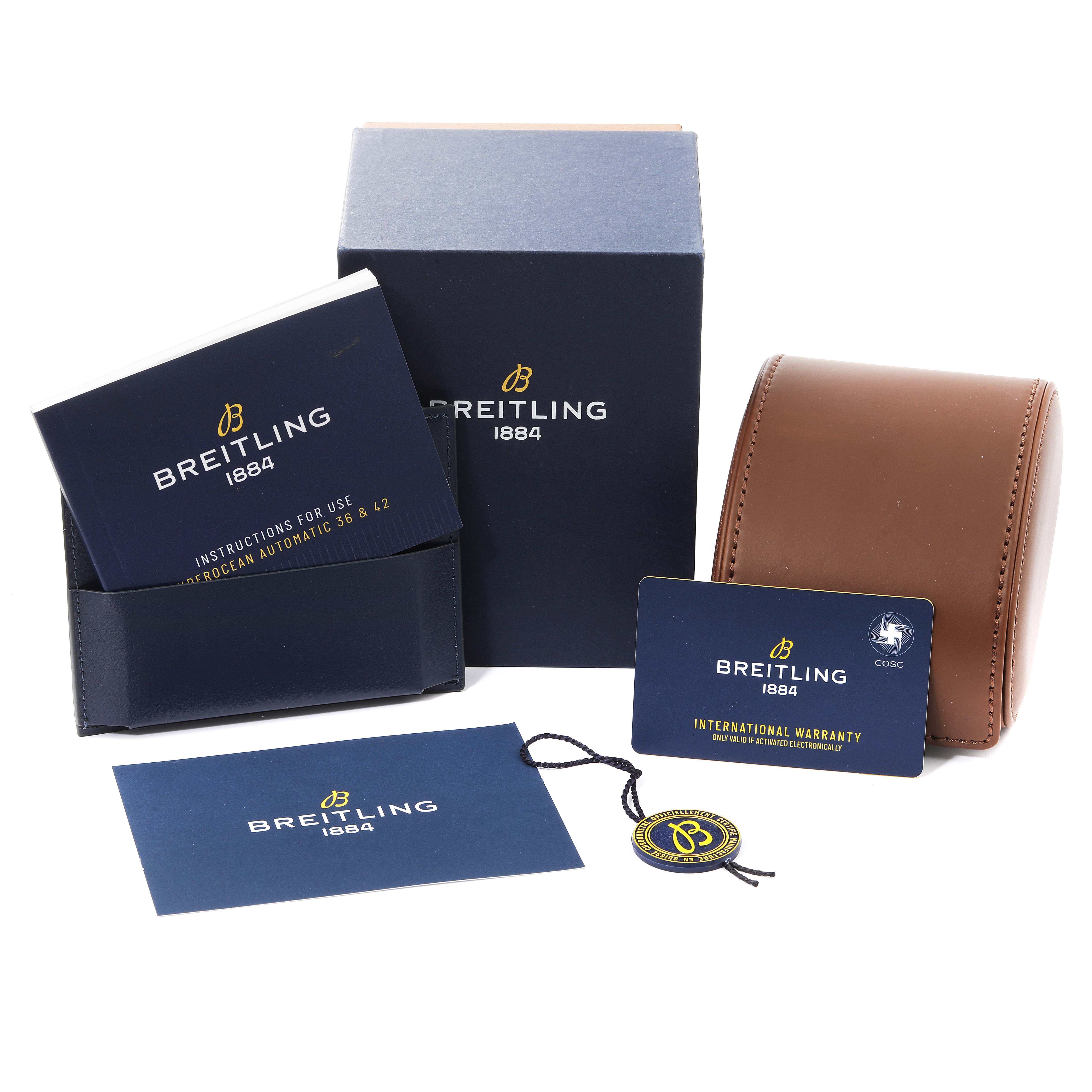 The image shows packaging and documents for the Breitling Superocean A17366 Men's Stainless Steel White Dial A17366 Men's Stainless Steel White Dial watch, including instructions, warranty card, box, and hang tag.