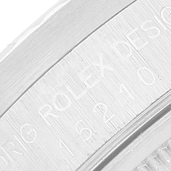 The close-up image shows the engraved side of the caseback of a Rolex Date 15210 Men's Stainless Steel Silver Dial 15210 Men's Stainless Steel Silver Dial model watch.