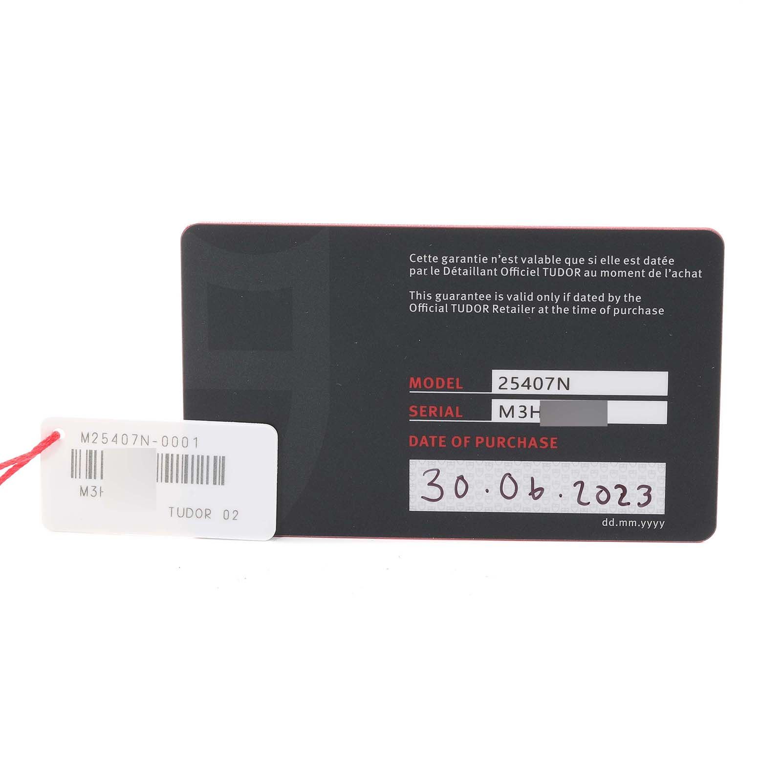 This image shows the warranty card for a Tudor Pelagos 25407N Men's Titanium Black Dial 25407N Men's Titanium Black Dial model 25407N watch with the date of purchase and serial number visible.