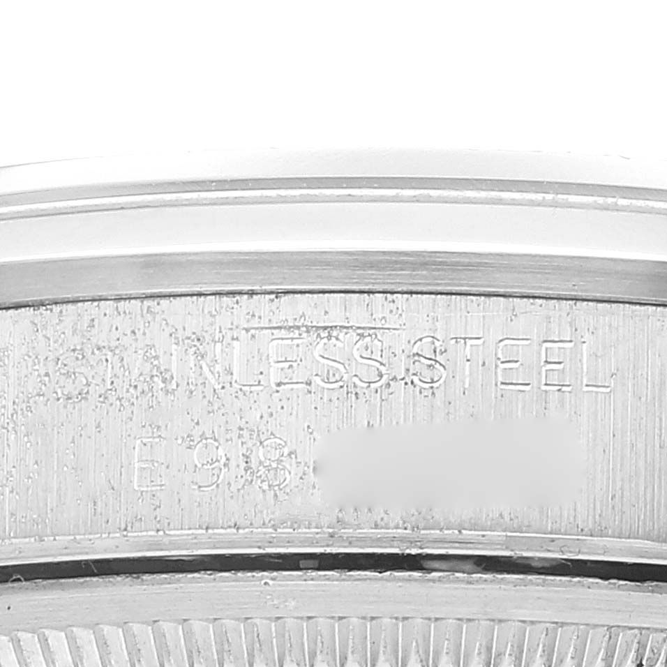 The image shows a close-up of the engraved case back of a Rolex Date 15200 Men's Stainless Steel Silver Dial 15200 Men's Stainless Steel Silver Dial model, highlighting the stainless steel material.