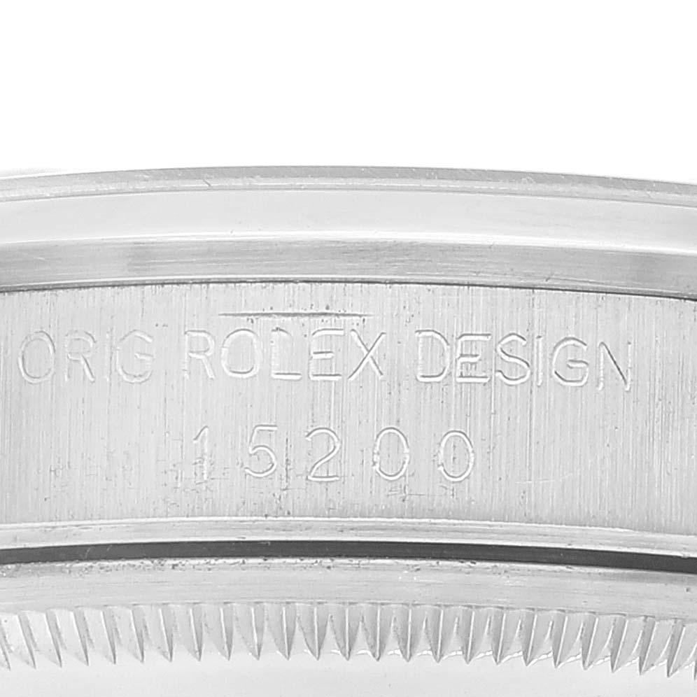 This close-up image shows the engraved side of the bezel of a Rolex Date 15200 Men's Stainless Steel Silver Dial 15200 Men's Stainless Steel Silver Dial model watch.