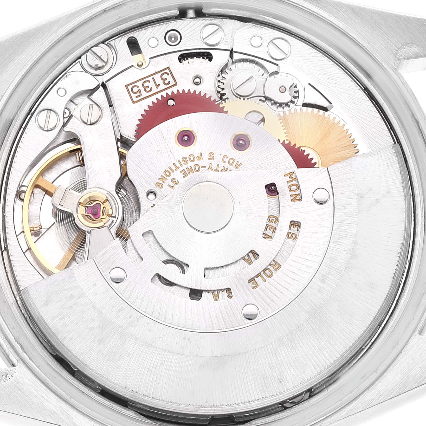 The image shows the internal mechanism of a Rolex Date 15200 Men's Stainless Steel Silver Dial 15200 Men's Stainless Steel Silver Dial model watch from a top-down angle, displaying its gears and components.