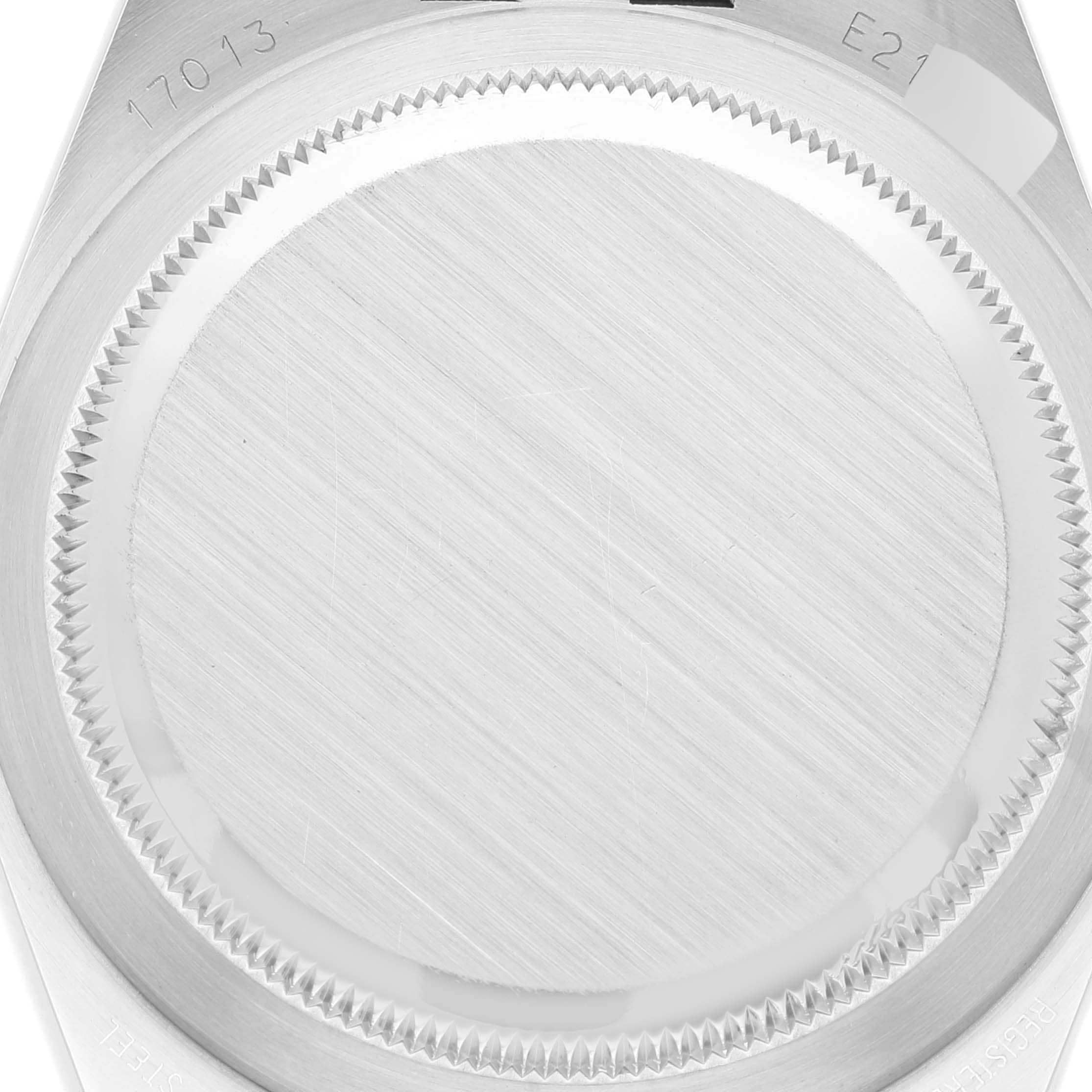 This image shows a close-up of the case back of a Rolex Oysterquartz 17013 Men's Stainless Steel Silver Dial 17013 Men's Stainless Steel Silver Dial model watch, highlighting the brushed metal finish and engraved model numbers.