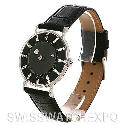 The image shows a side view of a Vintage Vacheron Constantin watch with a black leather strap and a black dial with silver accents.