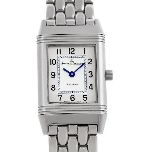 The image shows a front view of the Jaeger-LeCoultre Reverso watch, featuring its rectangular dial and metallic bracelet.