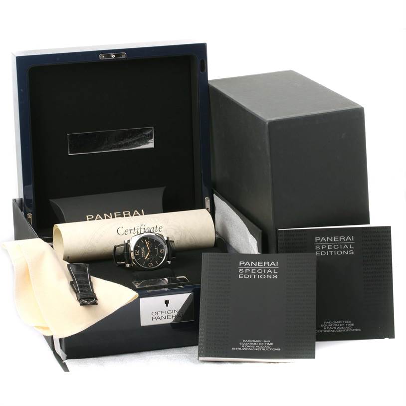 The image shows a Panerai Radiomir PAM00516 Men's Stainless Steel Black Dial PAM00516 Men's Stainless Steel Black Dial watch with its box, certificate, manuals, and a cleaning cloth from a slightly elevated angle.