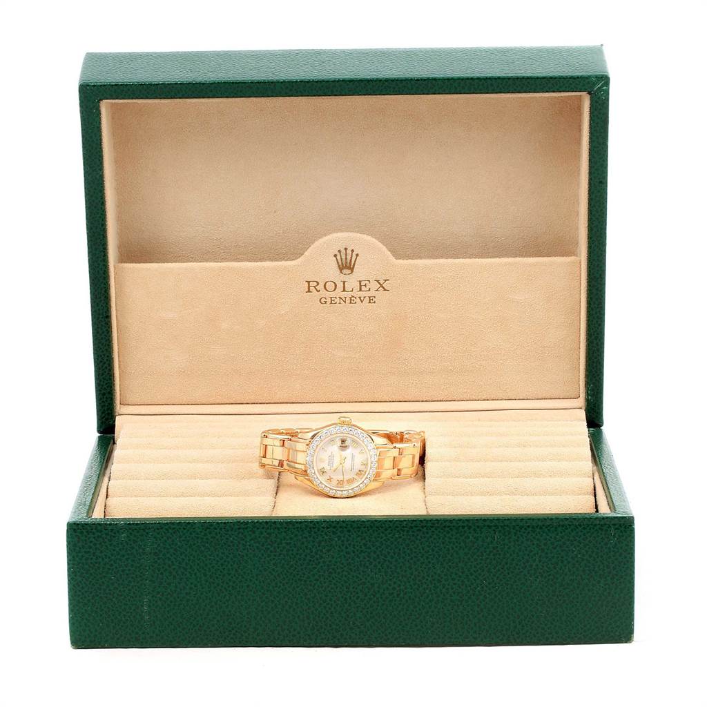 The Rolex Pearlmaster 69298 Women's Yellow Gold Mother of Pearl Dial 69298 Women's Yellow Gold Mother of Pearl Dial watch is displayed front-on inside its branded green and beige box.